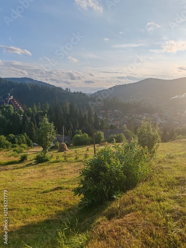 Scenic view of green Carpathian mountains hills covered with forest under cloudy sky