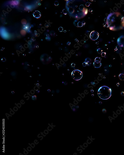 Vertical floating soap bubbles with neon reflections on dark background. Abstract glowing spheres. Glowing neon reflections of blue, magenta, and soft warm light outline