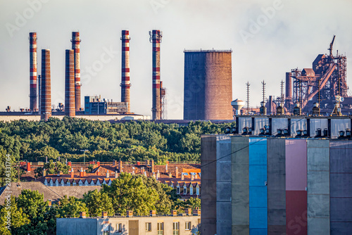 Photography Residential district beside heavy industry, illustrating the close relationship between urban life, manufacturing and the surrounding green environment