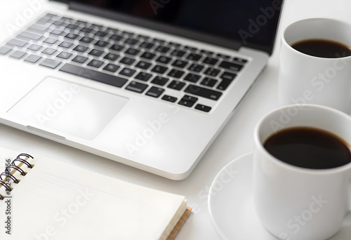 Laptop, two coffee cups, an...