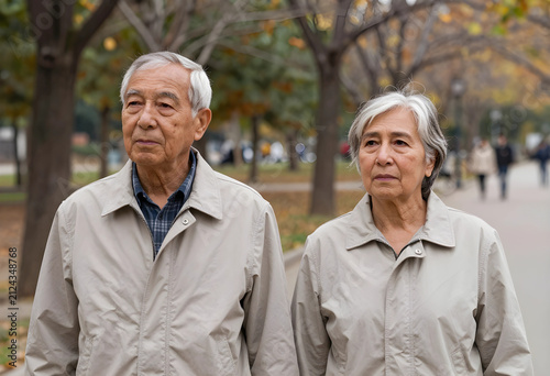 Elderly asian couple walkin...