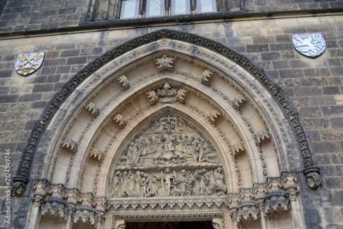 Obraz na plátně Gothic carved church portal arch with sculpted tympanum and decorative reliefs for historic architecture background and restoration