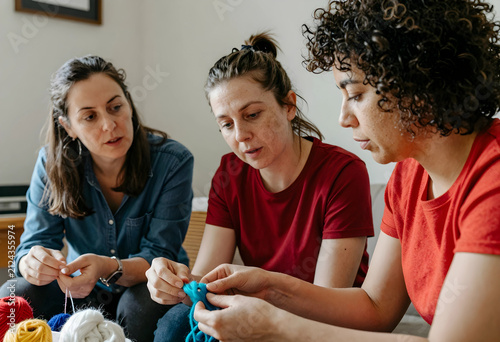 Three diverse women learnin...