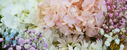 Colorful display of various flowers in a bright floral arrangement