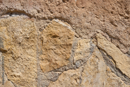 Rustic Limestone Stone Wall Texture with Weathered Stucco Surface, Natural Architectural Background