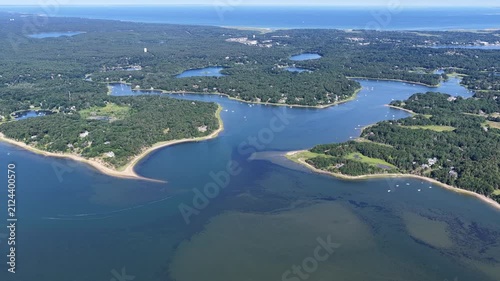 The shallow waters of Pleasant Bay are seen from a bird's eye view on a summer day. This beautiful body of water, fed by the Atlantic Ocean, is a part of Orleans and Chatham, Cape Cod, Massachusetts.