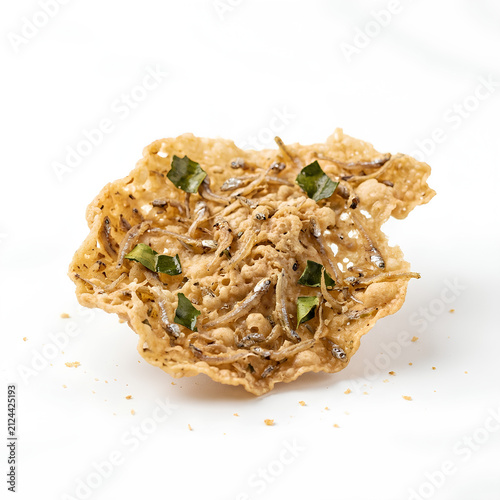 Closeup of Crispy Fried Chicken Nugget with Green Garnish.
