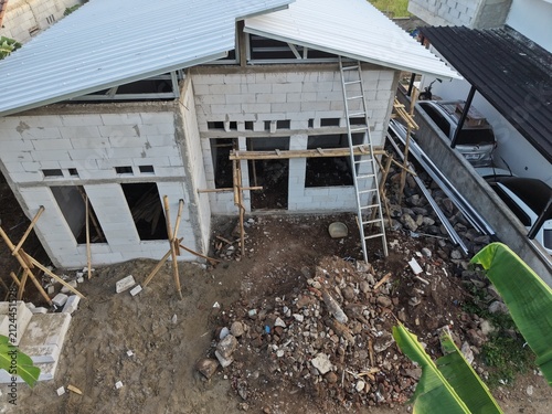 Construction Site With Concrete Building Under Roof Installation