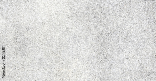 A textured surface featuring a subtle abstract pattern in shades of white and gray. Ideal for backgrounds and various design projects.