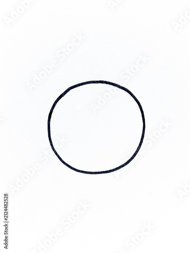 A minimalist hand drawn black circle centered conveying simplicity, balance and geometric form. Ideal for design, backgrounds, abstraction and minimal compositions.