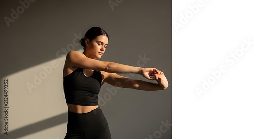 Young woman stretching her arms outside.