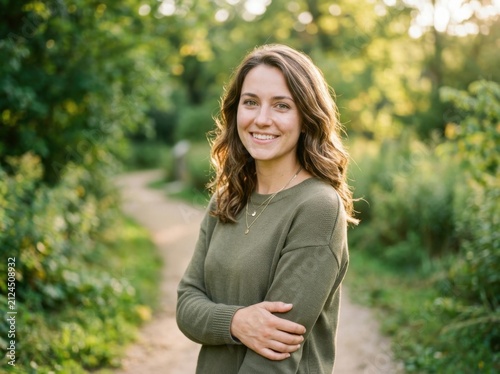 Smiling Young Woman Enjoying a Nature Walk Outdoors Amidst Lush Greenery Serene Moment