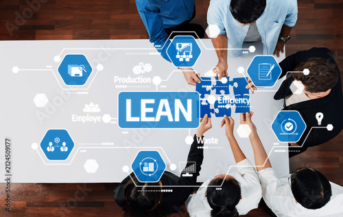 Картината върху платно A diverse team working together on lean efficiency strategies in a modern office setting, utilizing visual tools to enhance productivity and streamline processes