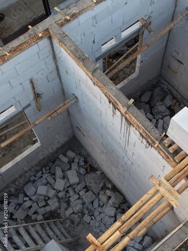 Construction Site Overhead View of Concrete Blocks and Bamboo Scaffolding