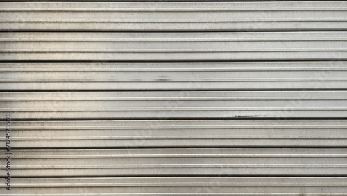 Metal roller shutter, corrugated steel texture, gray roller shutter, industrial texture with slight scratches or stains, metal steel door texture, texture