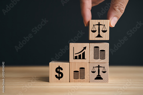 Hand stacking wooden blocks with symbols