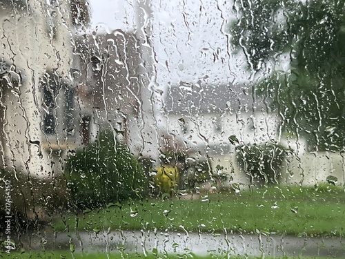 Raindrops on a car window during a storm.