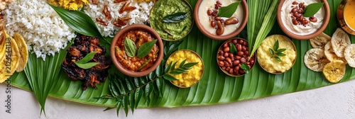 Traditional south indian sadya meal served on a banana leaf with rice, curries, and side dishes, onam festival banner realistic banner
