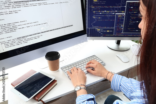 Female programmer coding on...