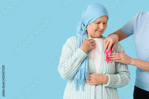 Women with pink ribbon on b...