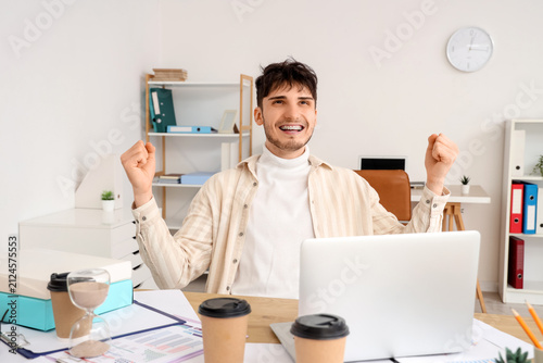 Excited young man with brac...