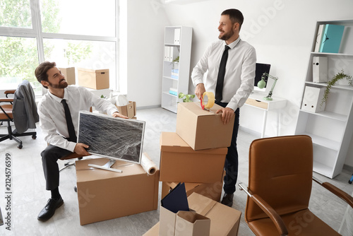 Business men packing things...