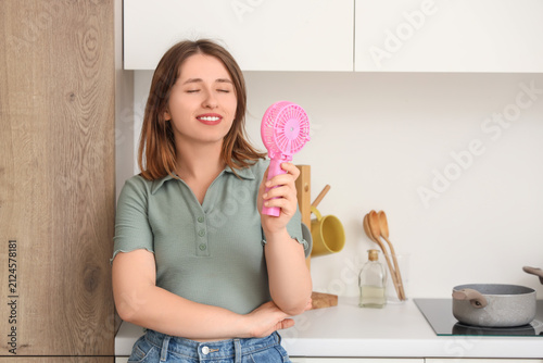 Young woman with small hand...