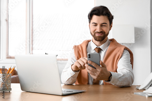 Handsome businessman workin...