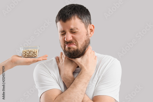 Sick young man and female h...