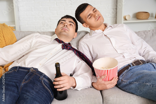 Young men with hangover aft...