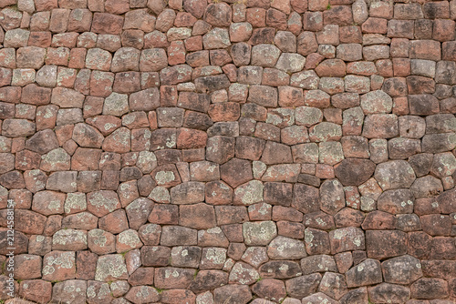 Ancient Inca stone wall texture at Huchuy Qosco archaeological site, Peru