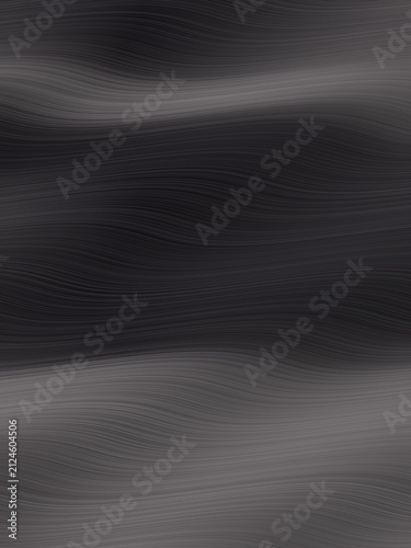 Smooth dark surface flows with subtle, elegant curves. Texture suggests metal or polished stone. Neutral tone invites focus on design or branding