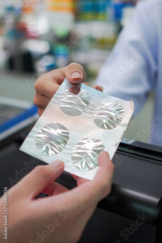 Vertical Close Up of Safe Medication Dispensing Using Light and Moisture Protective Blister Packaging in Community Pharmacy Practice