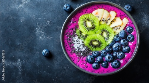 Vibrant Dragon Fruit Smoothie Bowl with Fresh Kiwi, Blueberries, and Banana on Dark Background