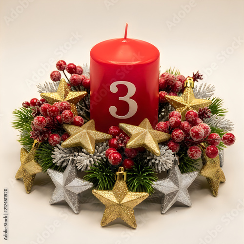 Advent candle number three with greenery