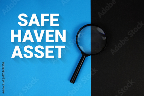 Картината върху платно Safe Haven Asset text with magnifying glass on blue and yellow background
