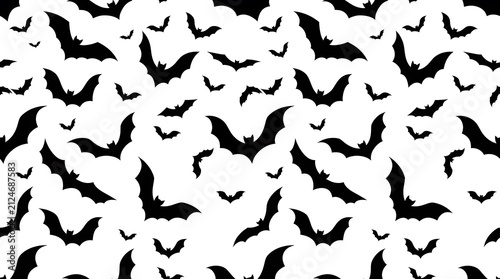 Seamless pattern with black bats isolated on white background