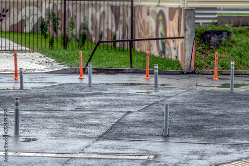 An empty parking lot on a rainy summer day