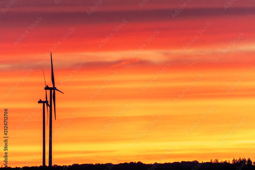 Obraz premium wind turbines at sunset
