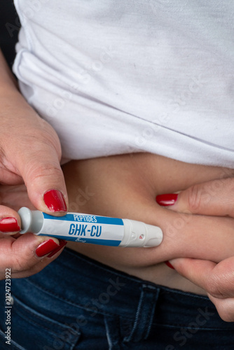 Woman Injecting Peptide CHK-CU 10 into Abdominal Fat at Home