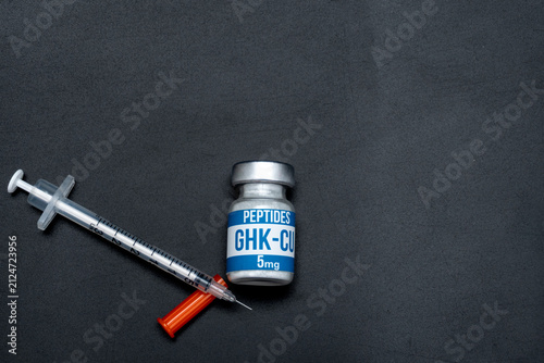 GHK-Cu Peptide Vial with Insulin Syringe on Black Background