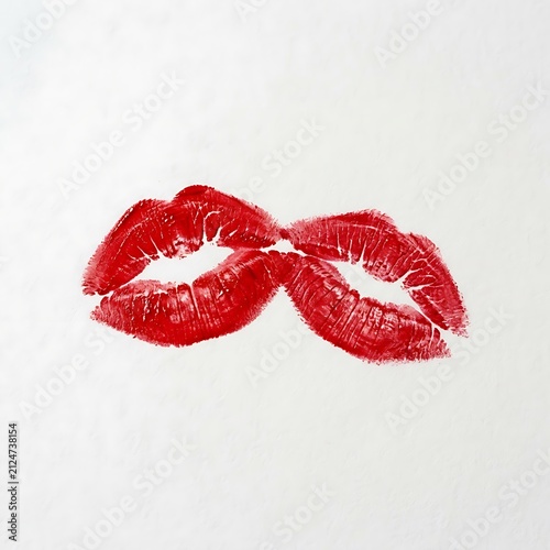 Red lipstick kiss mark on white background. Romantic lip print isolated on a clean surface.