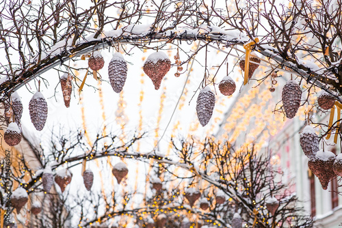 A beautiful Christmas background. The concept of decorations for the New Year 2027. Christmas trees on the streets of Moscow with festive illumination in the snow.