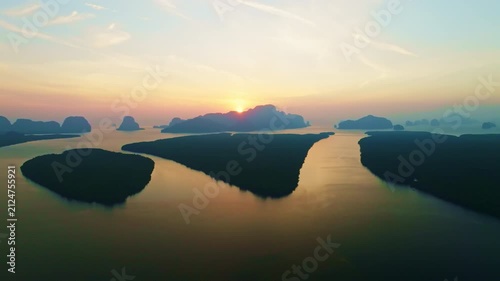 Colorful sunset or sunrise above the sea surface,Aerial view drone fly over open sea,Reflected sun beautiful light of nature on water surface,Sunset over ocean,Sea summer and travel vacation concept