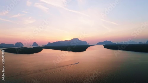Colorful sunset or sunrise above the sea surface,Aerial view drone fly over open sea,Reflected sun beautiful light of nature on water surface,Sunset over ocean,Sea summer and travel vacation concept
