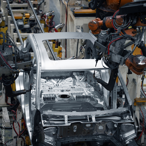 Automated Robotic Assembly Line Manufacturing Modern Car Body in Smart Factory