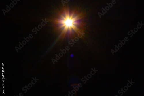Sun flare on the black background