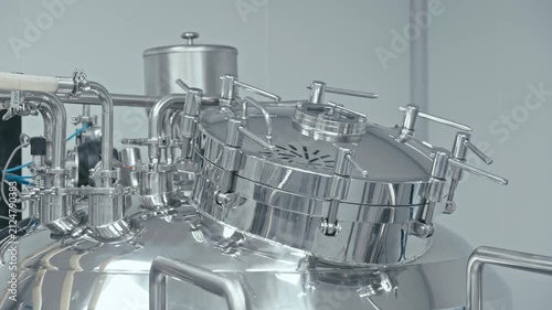 Factory machine at work. Production equipment at medical industry. Pipes, valves, and gauges. 4K, UHD