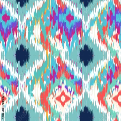 A vibrant modern Ikat bohemian seamless pattern featuring overlapping geometric diamond and zigzag shapes. The design stands out with its distinct fuzzy, brush-stroke edges that mimic traditional hand