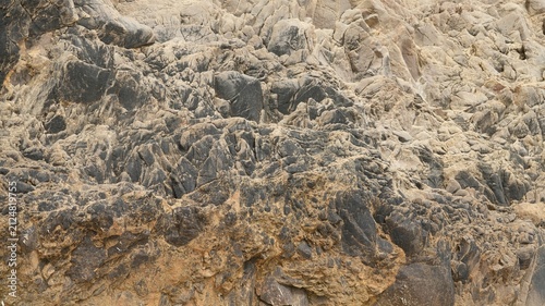 Fotografie The rough rock surface view near the sea